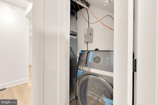 washroom featuring washer / dryer and light wood-type flooring