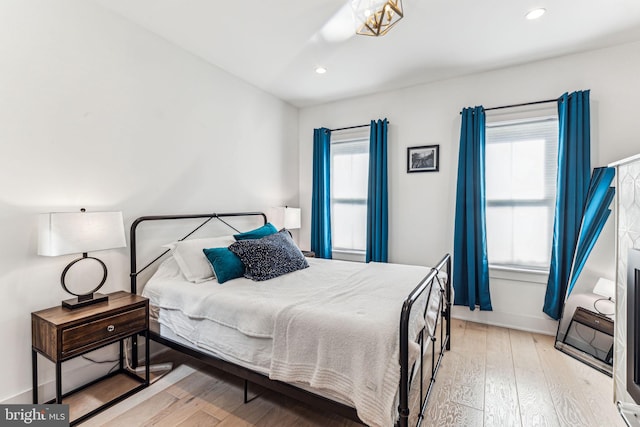 bedroom with light wood-type flooring