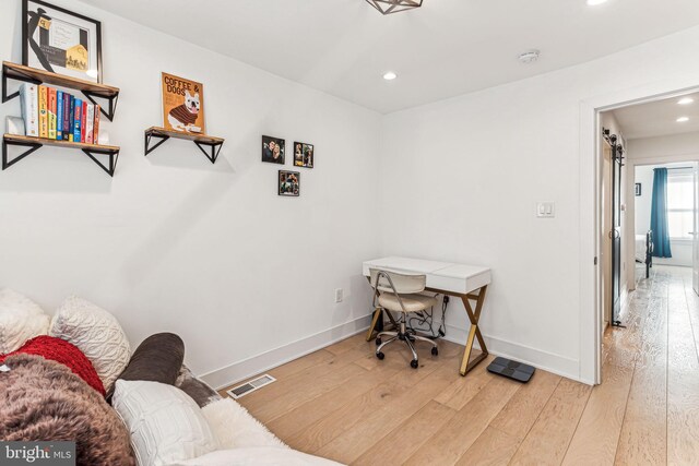 office with light hardwood / wood-style flooring