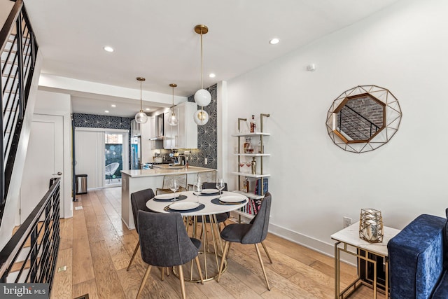 dining space with light wood-type flooring