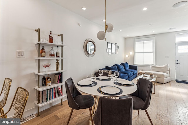 dining space featuring light hardwood / wood-style flooring