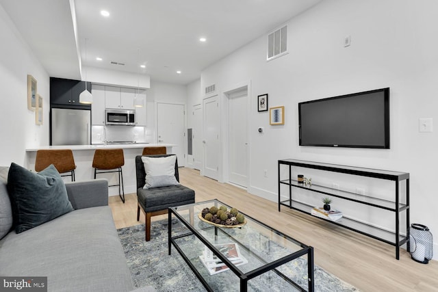 living room featuring light wood-type flooring