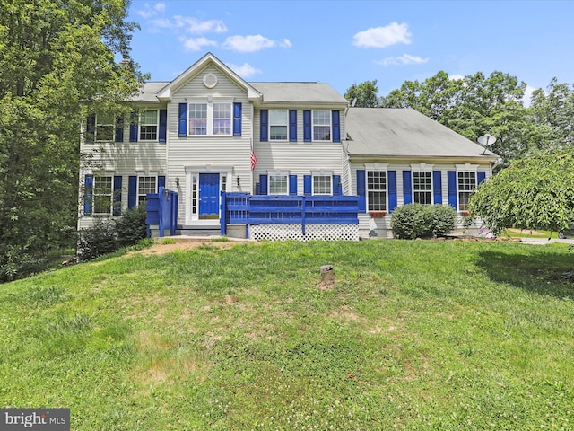 colonial-style house with a front yard