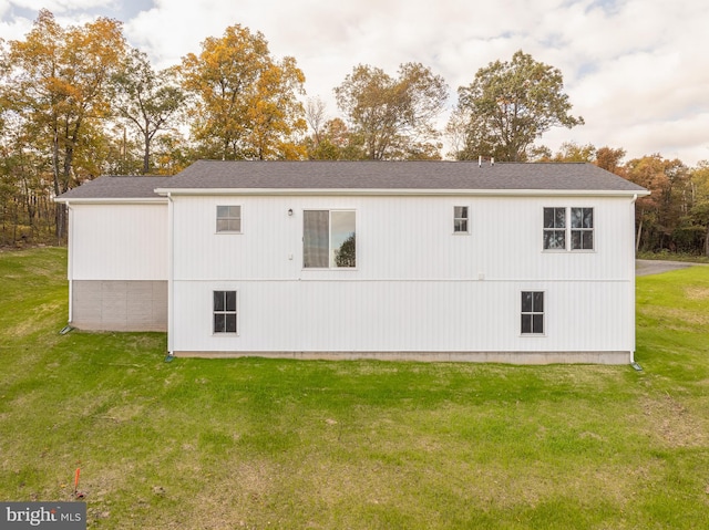 view of side of home featuring a lawn