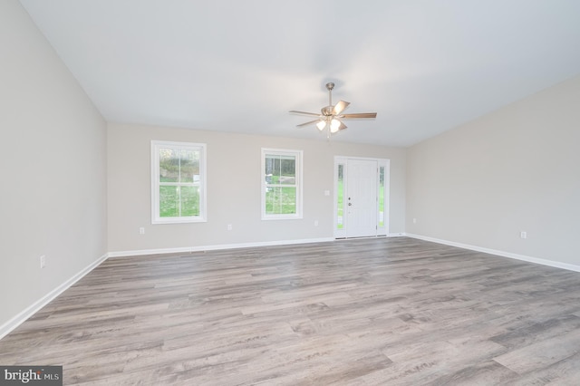 unfurnished room featuring ceiling fan and light hardwood / wood-style flooring