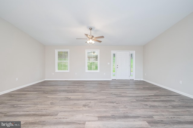 unfurnished room featuring ceiling fan and light hardwood / wood-style floors