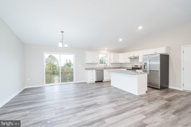 kitchen featuring a kitchen island, stainless steel appliances, light wood-type flooring, and white cabinetry