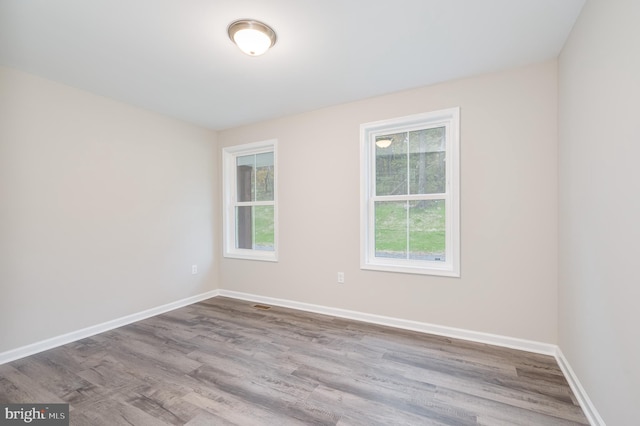 empty room with light hardwood / wood-style floors