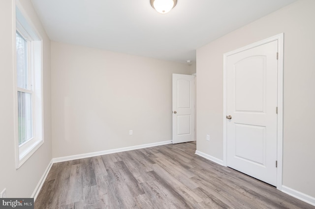 spare room with light hardwood / wood-style floors