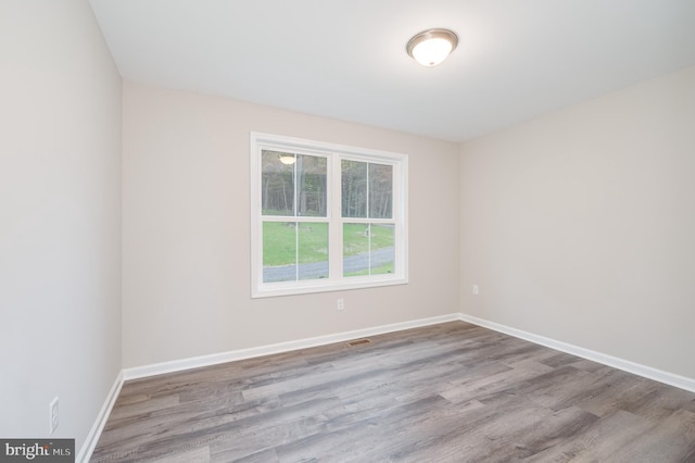 spare room featuring light wood-type flooring