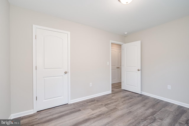 unfurnished bedroom featuring light hardwood / wood-style floors