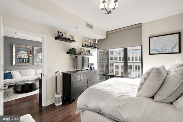 bedroom featuring dark hardwood / wood-style flooring