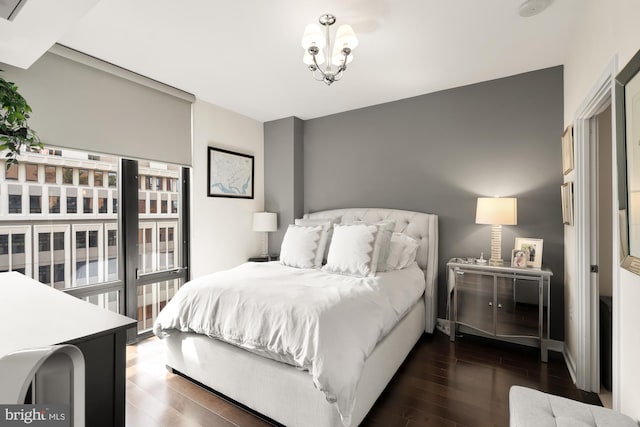 bedroom with dark wood-type flooring