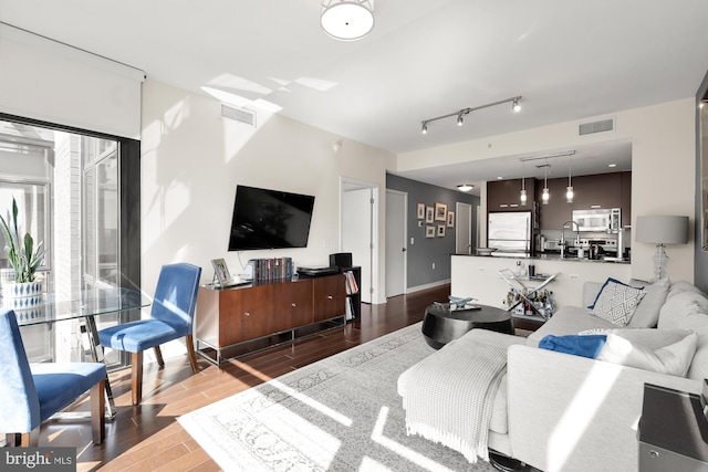 living room with dark hardwood / wood-style floors