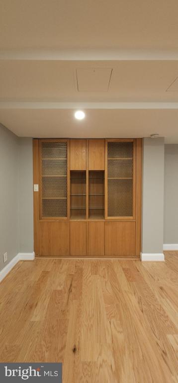 spare room with wood-type flooring