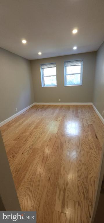 spare room with light hardwood / wood-style floors