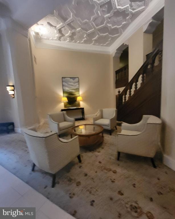 interior space featuring ornamental molding and light tile patterned floors