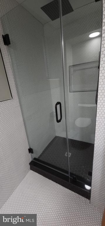 bathroom featuring walk in shower