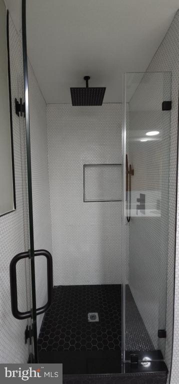 bathroom featuring walk in shower