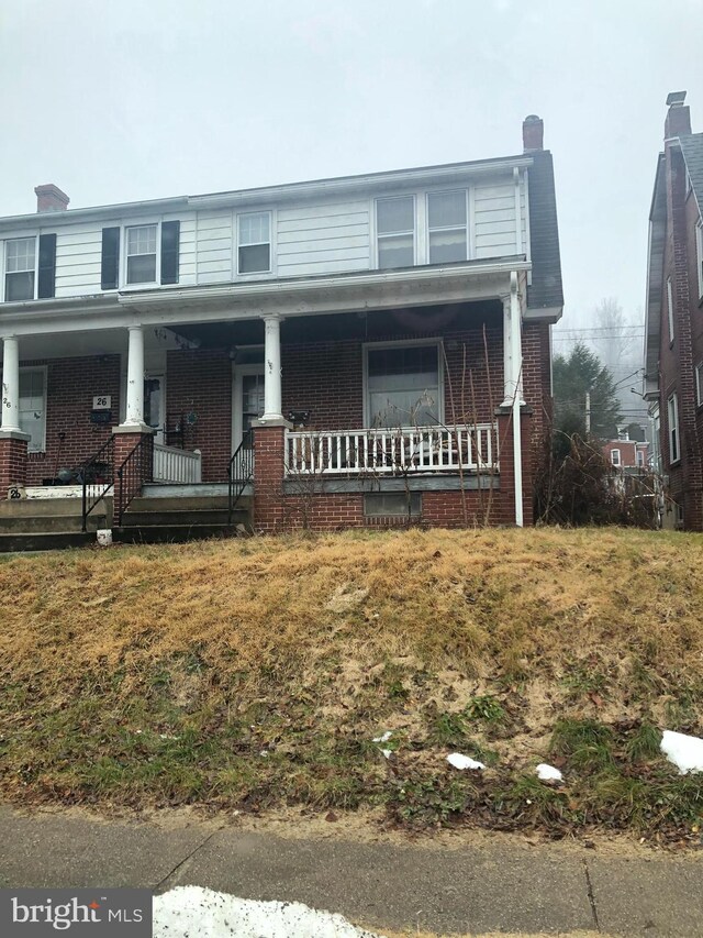 view of front of home featuring covered porch