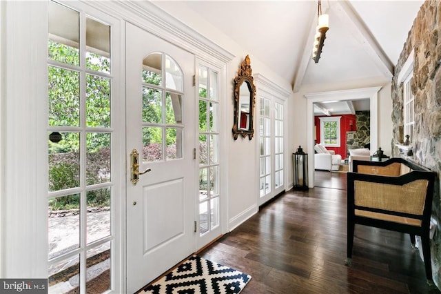 entrance foyer with lofted ceiling with beams, dark wood finished floors, and baseboards