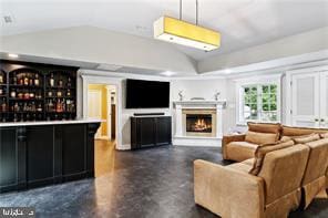 bar with hanging light fixtures and vaulted ceiling