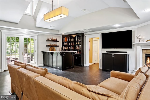 living area with a bar, baseboards, a premium fireplace, and vaulted ceiling