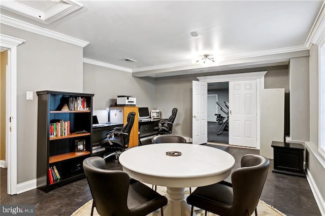 dining room with concrete floors, baseboards, and ornamental molding