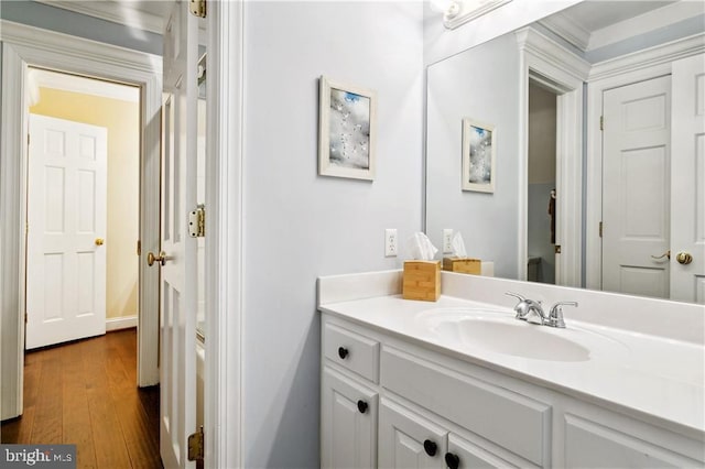 bathroom with vanity and wood finished floors