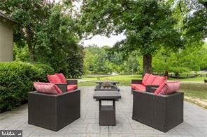 view of patio / terrace with a fire pit