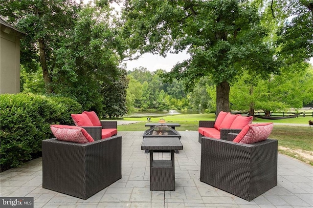 view of patio / terrace with an outdoor living space and fence