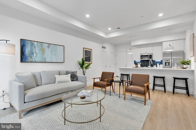 living room with light hardwood / wood-style floors