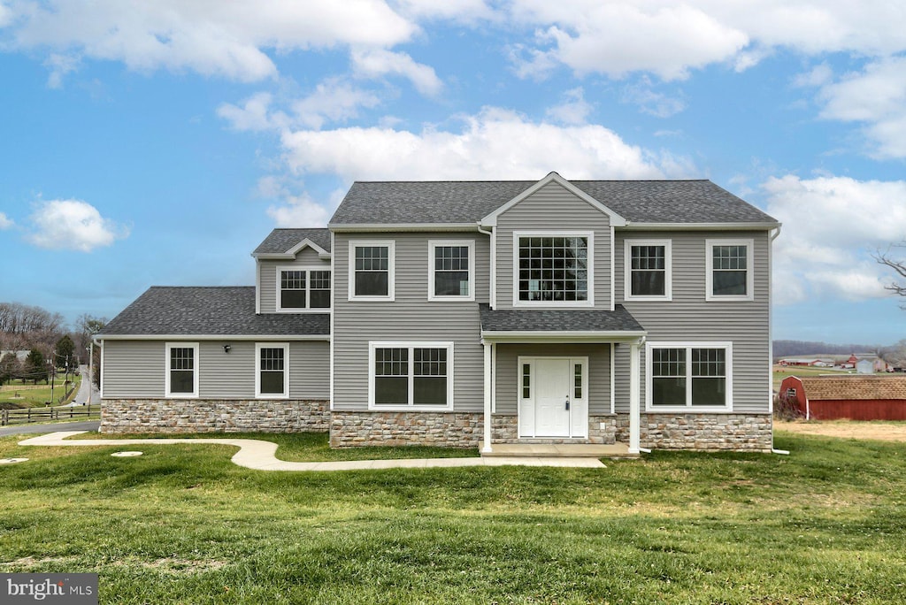 view of front of home with a front lawn