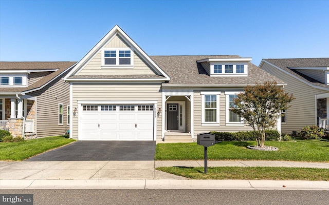 craftsman-style home with a garage and a front yard