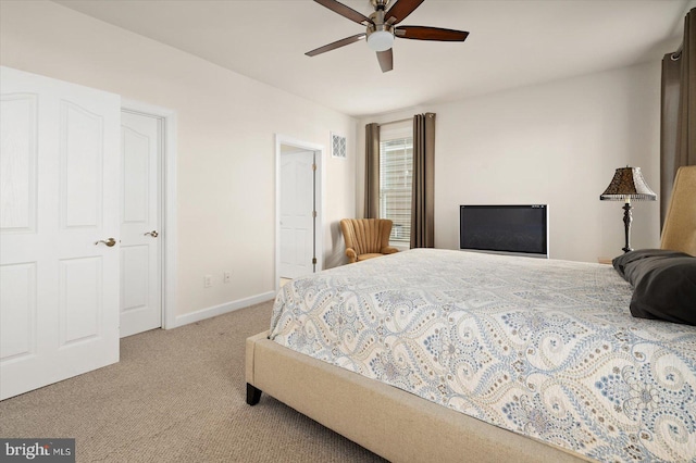 bedroom featuring light carpet and ceiling fan