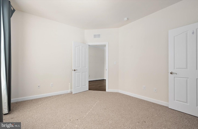 unfurnished bedroom featuring carpet