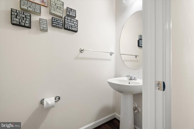 bathroom featuring hardwood / wood-style flooring and sink