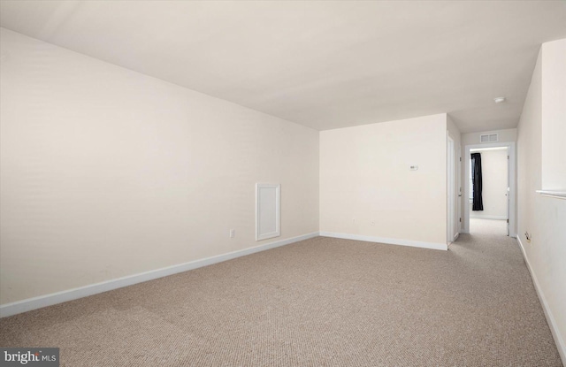 unfurnished room with light carpet