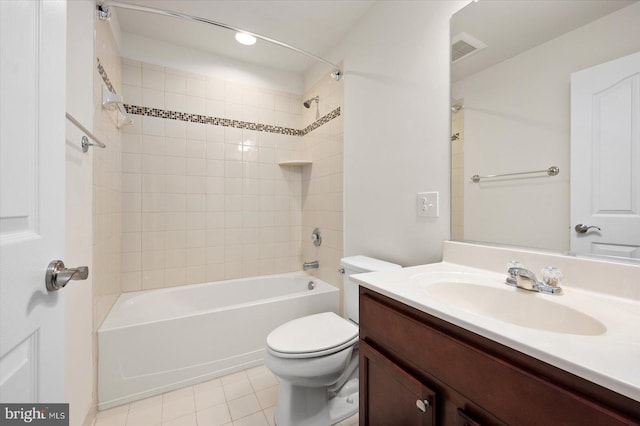 full bathroom with tile patterned flooring, vanity, toilet, and tiled shower / bath