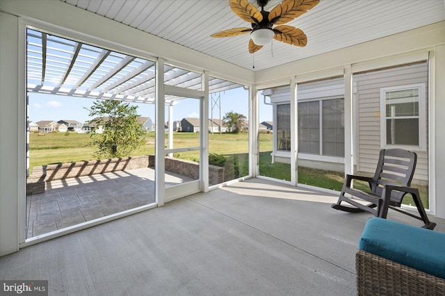 sunroom / solarium with ceiling fan