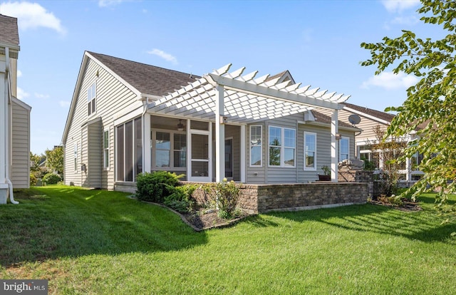 back of house with a sunroom, a pergola, and a yard