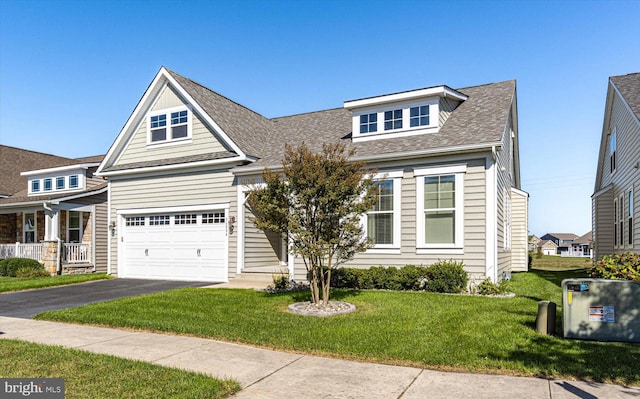 view of front facade featuring a garage and a front yard