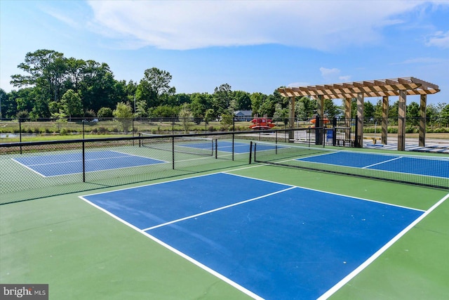 view of tennis court with basketball hoop