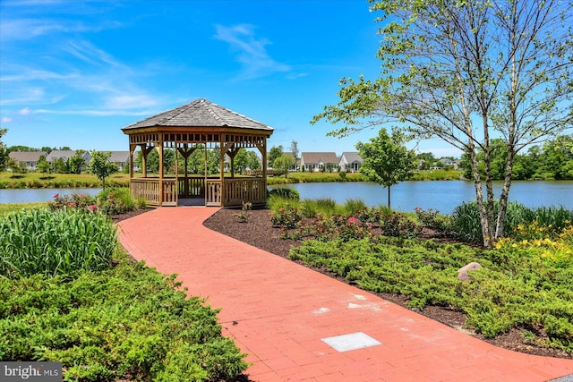 view of community with a water view and a gazebo