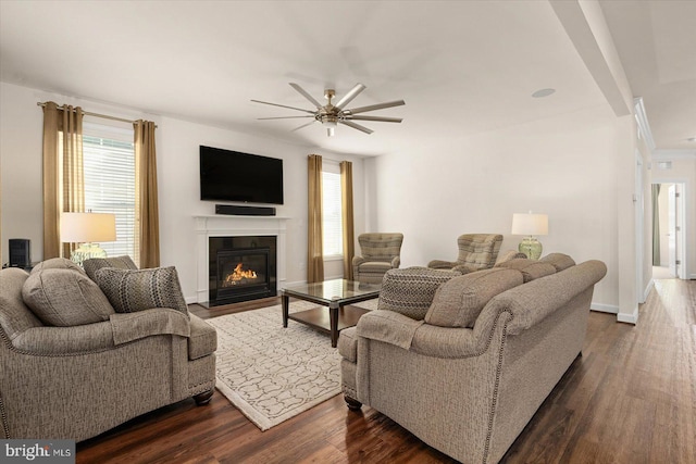 living room featuring dark hardwood / wood-style floors and ceiling fan