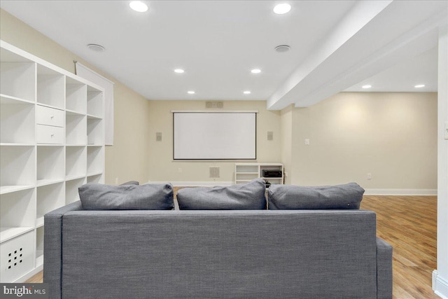 home theater with light hardwood / wood-style floors