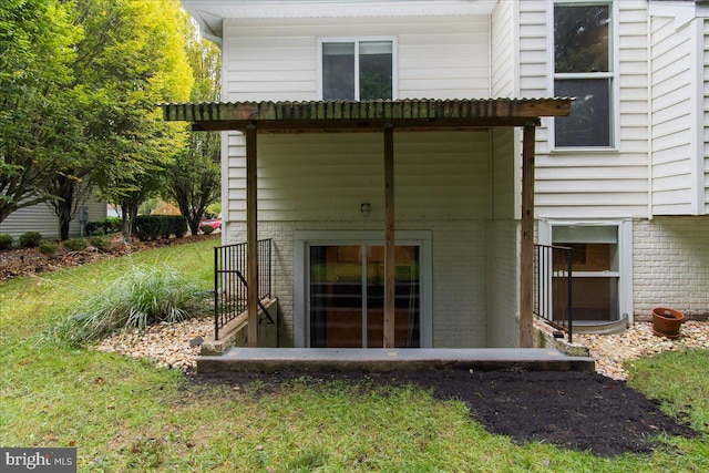 rear view of house with a lawn