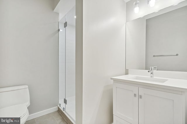 bathroom with toilet, tile patterned flooring, an enclosed shower, and vanity