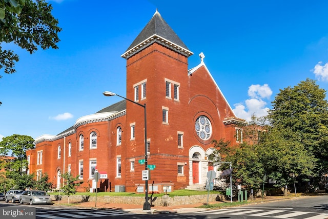 view of building exterior with central AC