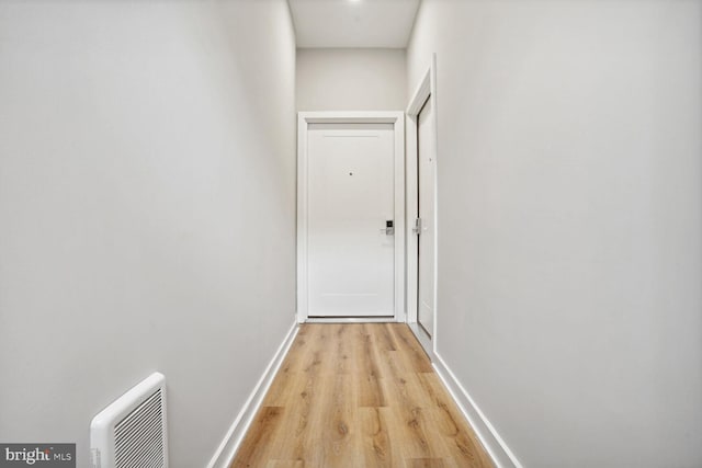 hall with light hardwood / wood-style floors